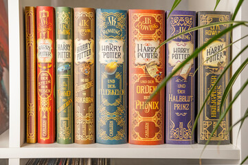 Naklejka premium J.K. Rowling's Harry Potter books in various editions, evoking sense wonder and excitement for readers all ages, and celebrating power imagination and storytelling, Frankfurt - December 22, 2023
