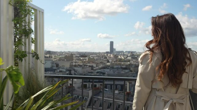 Girl Walking on Parirsian Roof and watch panorama picture on the city