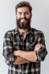 Obraz premium A man with a beard wearing a plaid shirt, outdoors