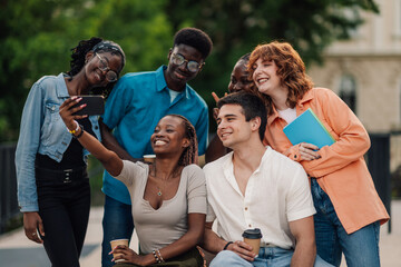 Portrait of diverse college friends taking selfie at university campus