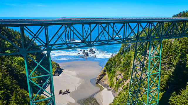 Aerial View of Green Steel Truss Bridge Over Coastal Brookings Oregon