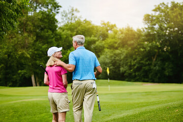 Mature, people and walk for golf or back, outside and healthy fitness activity with golfers together with club. Relaxing, weekend break and cardio sport, outdoor exercise and couple on course