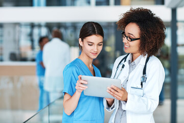 Women, doctor and nurse with tablet, healthcare and online reading for research, update schedule and advice. People, employees and medical with professional, technology or connection with digital app