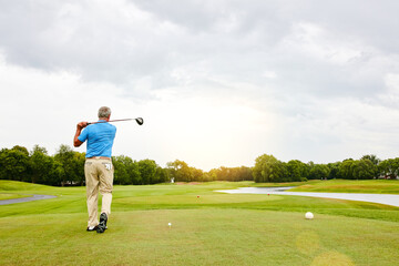 Mature, man and swing on golf course or nature for recreation sport, practice and training for tournament match. Male golfer, country club and back with workout for coordination and exercise.