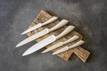 Casting steel various chef knife, Set of modern sharp kitchen knives on dark background