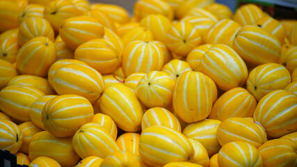 Oriental melons piled up in a fruit shop