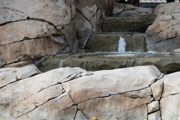 stone pillars and iron archway leading to secret fountain