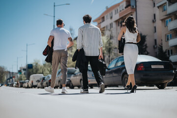 Fototapeta premium Cross-generational business colleagues discuss strategies and growth in a dynamic urban setting.