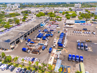 County trash collection HQ. Aerial drone photo of garbage trucks at a storage and repair facility