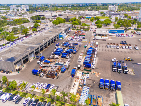 County trash collection HQ. Aerial drone photo of garbage trucks at a storage and repair facility