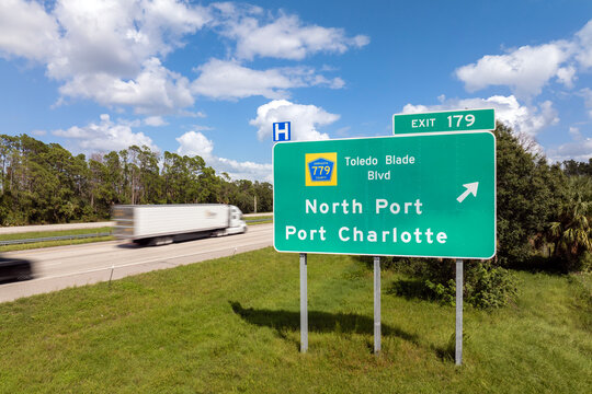 Freeway directional exit sign on interstate road in Florida, USA. I-75 highway junction leading to North Port and Port Charlotte