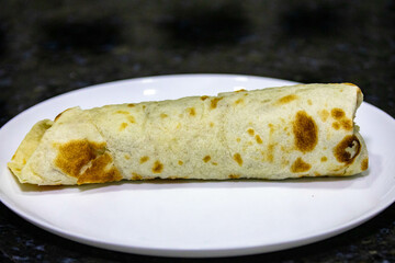 Traditional Shawarma sandwich fresh roll of, Grilled Meat and salad tortilla wrap with white sauce isolated on white background. Details