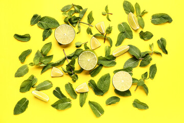Composition with fresh mint leaves and limes on yellow background