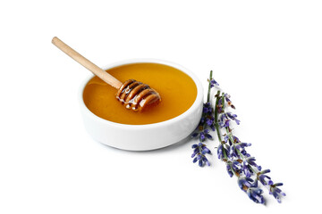 Bowl of sweet lavender honey, dipper and flowers on white background