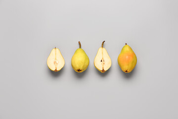 Fresh pears on grey background