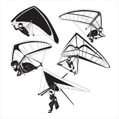 Hang gliders fly in the blue sky