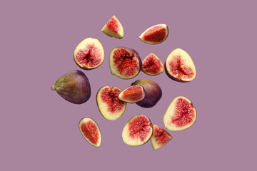 Fresh ripe figs on purple background