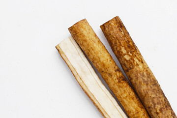 Burdock Root (Gobo) on white background.