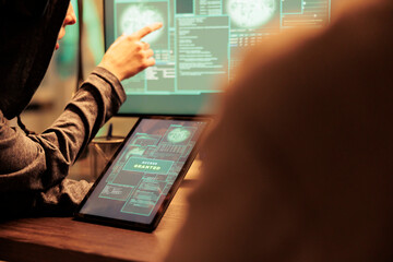 Hackers gettng access to important database online on computer network, planting virus to create malware. Team of spies working on cyberterrorism attack with online script codes.