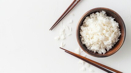 Asian rice bowls with chopsticks on a white background