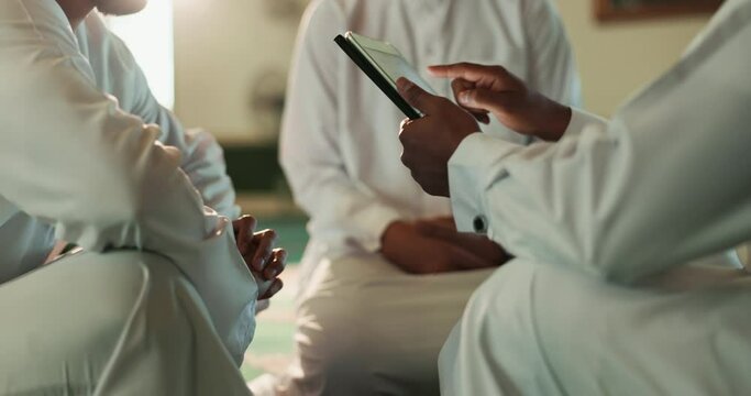 Hands, tablet and teaching with Islamic people reading Quran online together in Mosque for faith. Belief, religion or scripture and students learning with Mullah for Muslim culture or tradition
