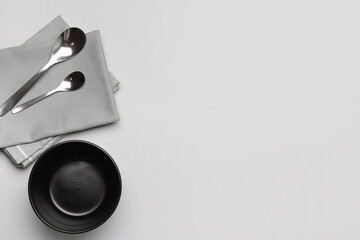 Simple table setting with napkin on white background