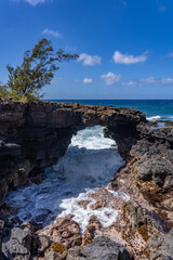 Lava rock Sea Arch, Makahuena Light, Koloa, Kauai South Shore，Hawaii. Koloa Volcanics	
