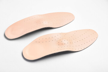 Leather orthopedic insoles isolated on white background