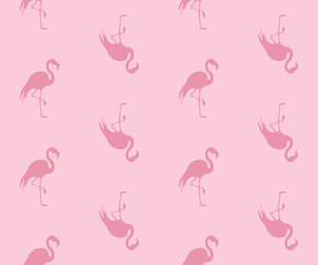 Różowe flamingi. Wzór bezszwowy. Sylwetki ptaków na różowym tle. © Monika
