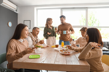 Business colleagues having lunch in office kitchen