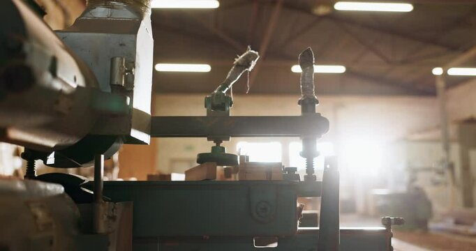 Wood, workshop and carpentry with tools, machinery and construction with startup, lens flare and business. Engineering, empty and equipment for service, warehouse and industrial with manufacturing