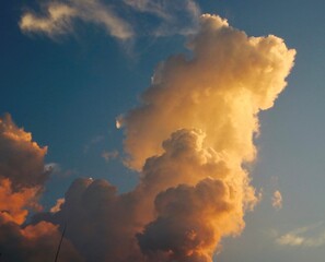 Tall golden cumulus clouds high above the beach in Florida in the afternoon