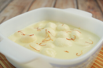 close up of indian sweet in a bowl on table.