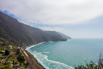 view from corniglia cinque terre italy to manarola ocean and green tree covered land 2
