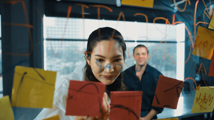 Young confident businesswoman present project to expert investor. Professional project manager uses...
