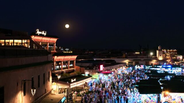 Marrakech - Morocco: Jamaa el Fna Souk square by night offers incredible shopping experience. Imperial old fortified city packed with vendors and their stalls. This medina is UNESCO WHS