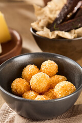 Preparing Tempura Cheese Balls in Home Kitchen: Middle-Aged Caucasian Woman Cooking at Noon