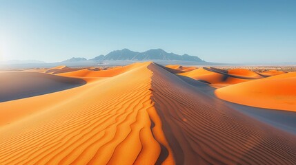 Desert Dunes at Sunrise with Mountains in the Distance