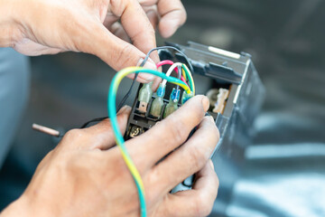 Technician check air conditioning control board, Repairman fixed air conditioning systems, Technician man service repair and maintenance of air conditioners.