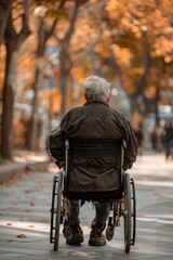 old person uses a wheelchair on solid background