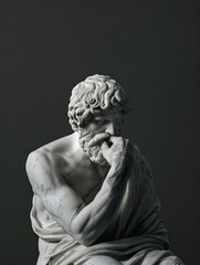 greek statue of a stoic with a sad expression on dark background