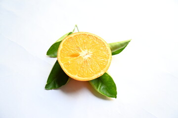 Fresh orange on white background. It is the fruit of a tree in the family Rutaceae. The main vitamins found in oranges are vitamin C, flavonoids and carotenoids. Its a popular fruit of all over world.