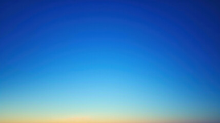 Obraz premium An abstract image of a sky at twilight with a gradient of blue shades blending into dusk