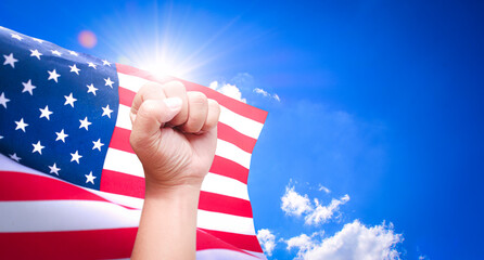 Happy independence day concept , American flags wave close and fist confidence acting with sunlight...