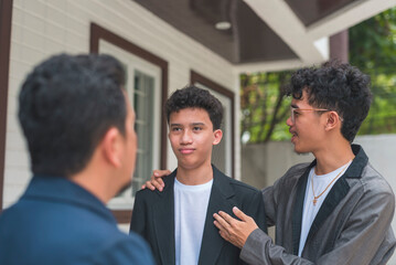 An Asian man teases his son alongside his brother. The son responds with a sarcastic expression...