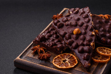 Black bitter chocolate with whole hazelnuts, candied fruits and mint