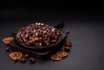 Black bitter chocolate with whole hazelnuts, candied fruits and mint
