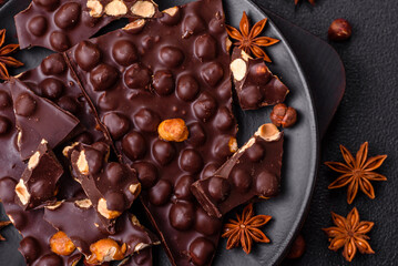 Black bitter chocolate with whole hazelnuts, candied fruits and mint