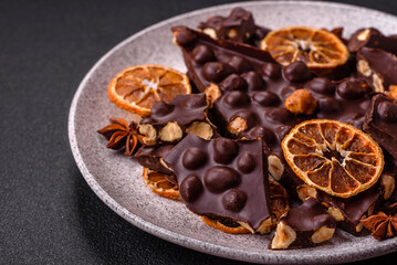 Black bitter chocolate with whole hazelnuts, candied fruits and mint