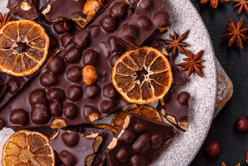 Black bitter chocolate with whole hazelnuts, candied fruits and mint
